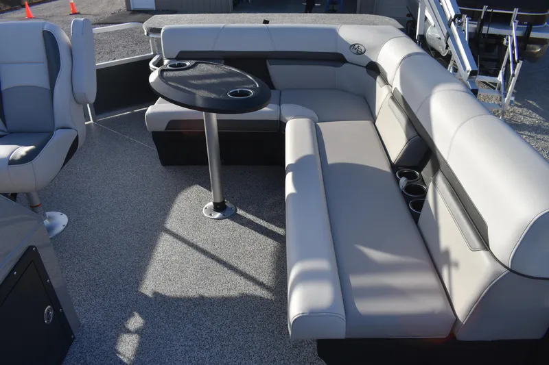 Slide: The Image of 2025 Montego Bay 90HP C8520 STD Cruise Pontoon interior with seating and table. - 16