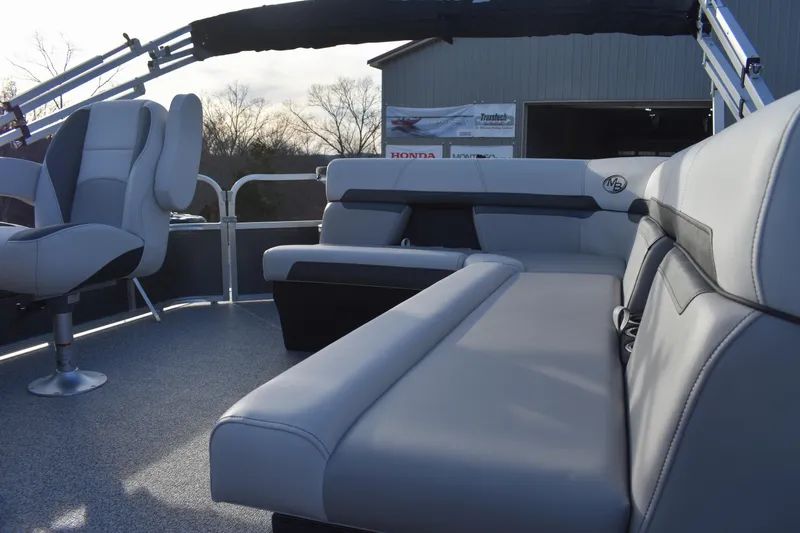 Slide: The Image of 2025 Montego Bay 90HP C8520 STD Cruise Pontoon interior with plush seating. - 17