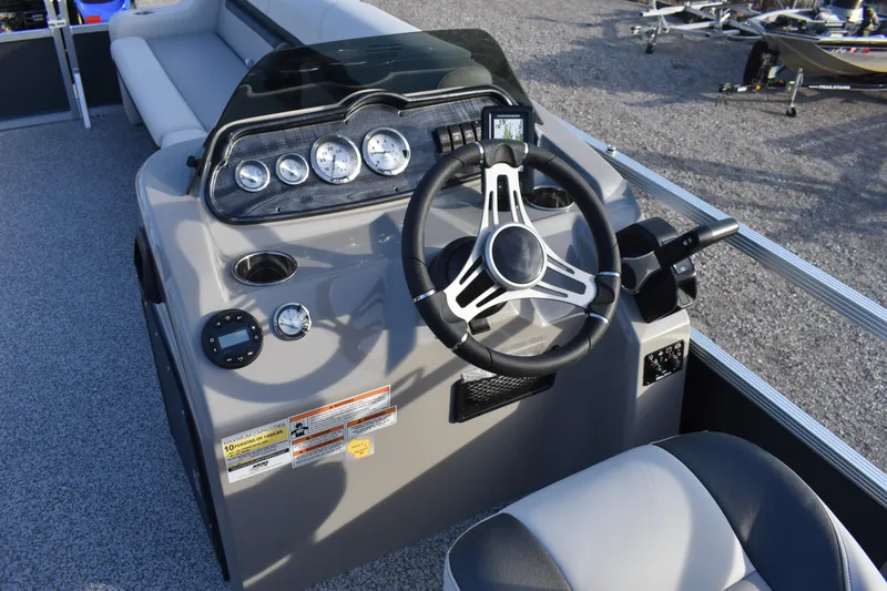 Slide: The Image of 2025 Montego Bay 90HP C8520 STD Cruise Pontoon dashboard with steering wheel and gauges. - 19