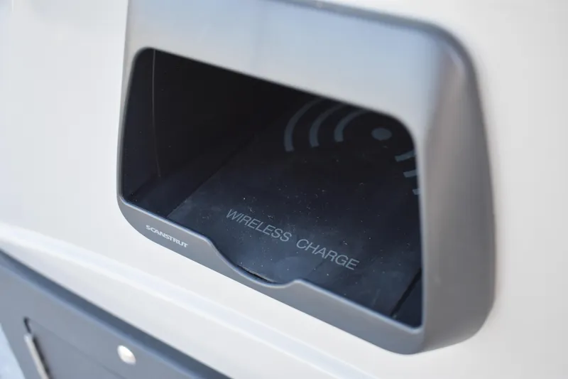 Slide: The Image of Wireless charging station on 2025 Montego Bay 90HP C8520 STD Cruise Pontoon. - 24