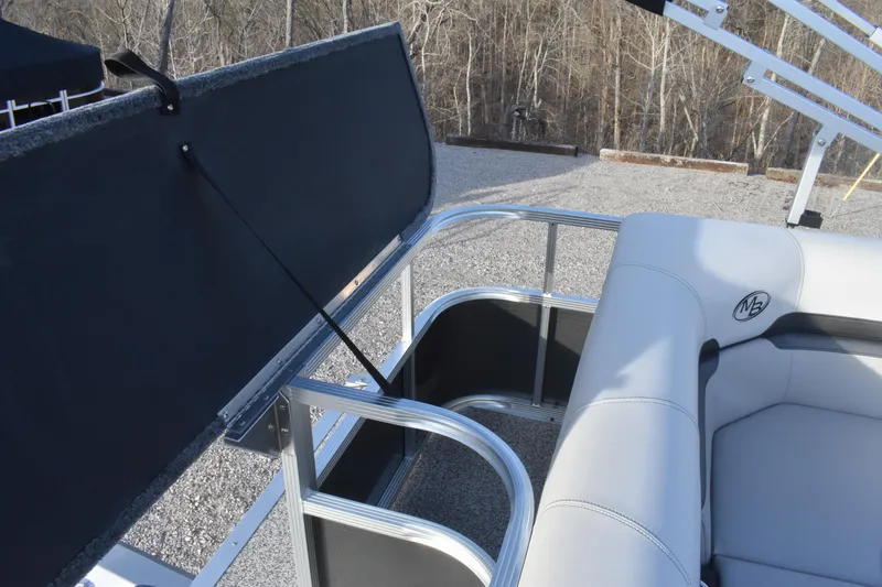 Slide: The Image of 2025 Montego Bay 90HP C8520 STD Cruise Pontoon with open storage compartment and seating. - 25