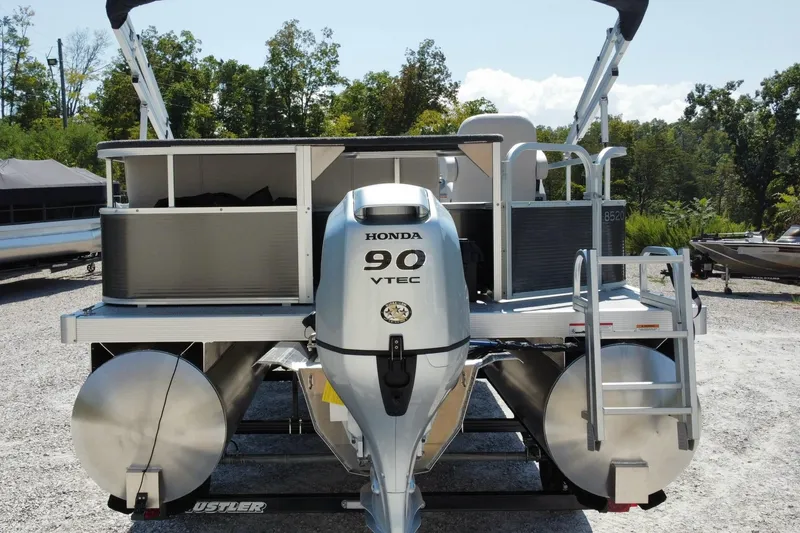 Slide: The Image of 2025 Montego Bay 90HP C8520 STD Cruise Pontoon with Honda engine, parked outdoors. - 8