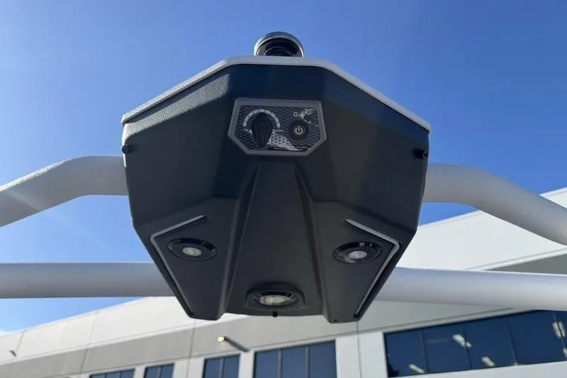 Slide: The Image of 2025 Malibu Wakesetter 26 LSV tower speaker system under clear blue sky. - 10