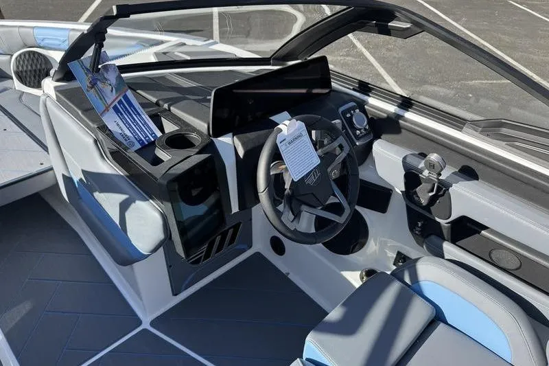 Slide: The Image of 2025 Malibu Wakesetter 26 LSV interior with modern dashboard and steering wheel. - 6