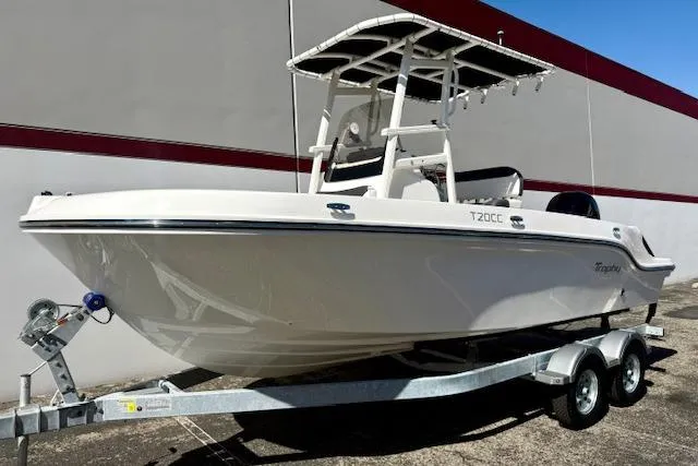 The Image of 2026 Bayliner Trophy T20CC boat on trailer, parked outdoors, showcasing sleek design and modern features. - 0