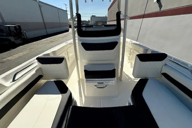 Slide: The Image of 2026 Bayliner Trophy T20CC boat interior with cushioned seating and storage compartments. - 18