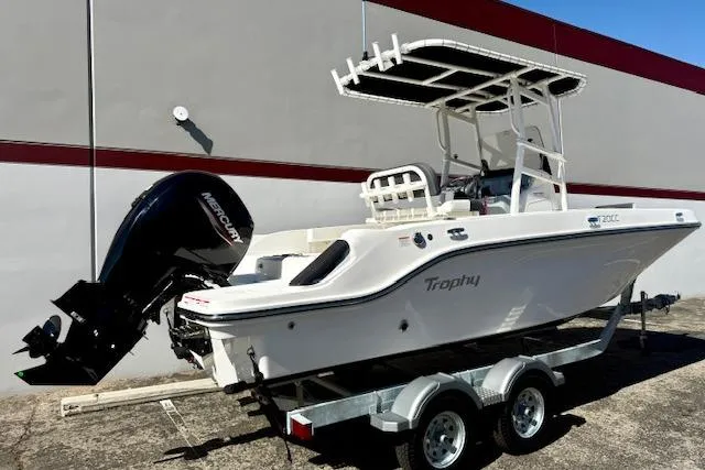 Slide: The Image of 2026 Bayliner Trophy T20CC boat on trailer, featuring Mercury outboard motor. - 3