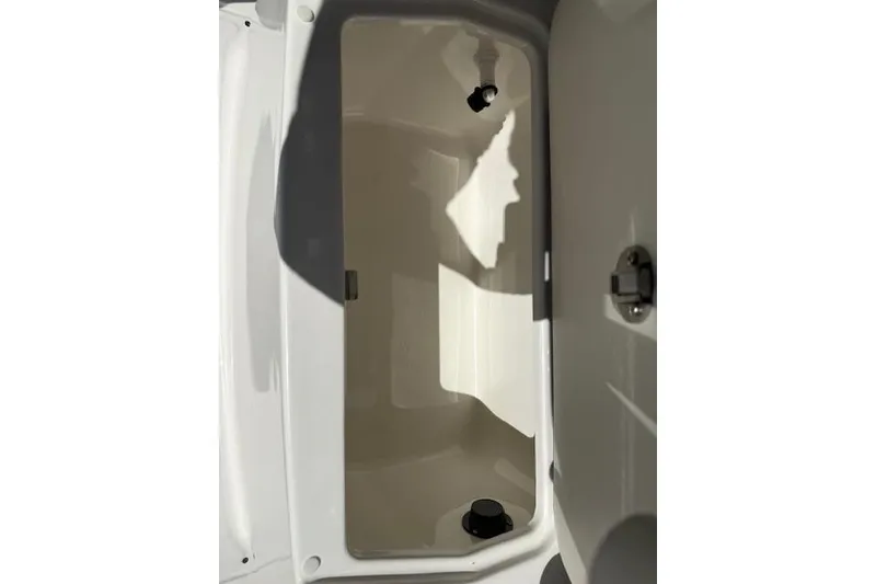 Slide: The Image of Storage compartment inside 2026 Bayliner Trophy T20CC boat, featuring sleek design and secure latch. - 8