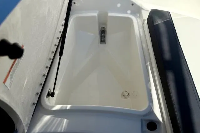Slide: The Image of 2026 Bayliner Trophy T20CC boat storage compartment with cushioned seating. - 9