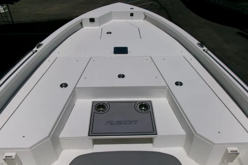 Slide: The Image of Avid 21 Fusion 2022 boat deck with sleek white design and storage compartments. - 11