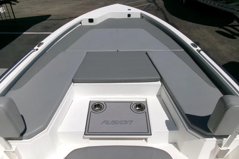 Slide: The Image of 2022 Avid 21 Fusion boat interior with gray seating and cup holders. - 12