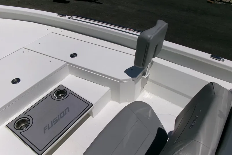 Slide: The Image of 2022 Avid 21 Fusion boat interior with gray seating and Fusion branding. - 13