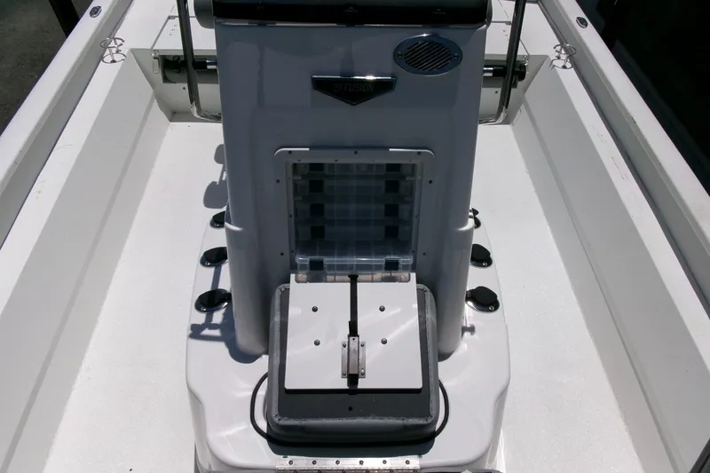 Slide: The Image of 2022 Avid 21 Fusion boat interior with storage compartment and seating area. - 16