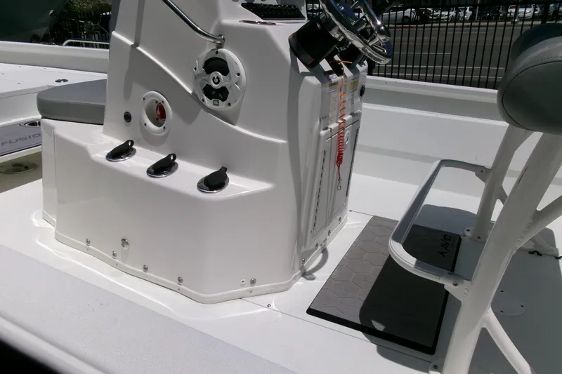 Slide: The Image of Avid 21 Fusion 2022 boat interior with steering console and seating. - 21