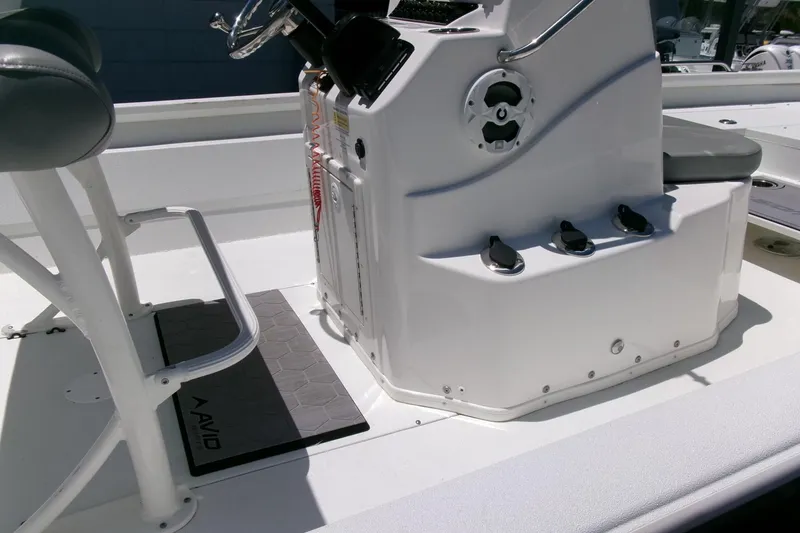 Slide: The Image of Avid 21 Fusion 2022 boat interior with steering console and seating area. - 22