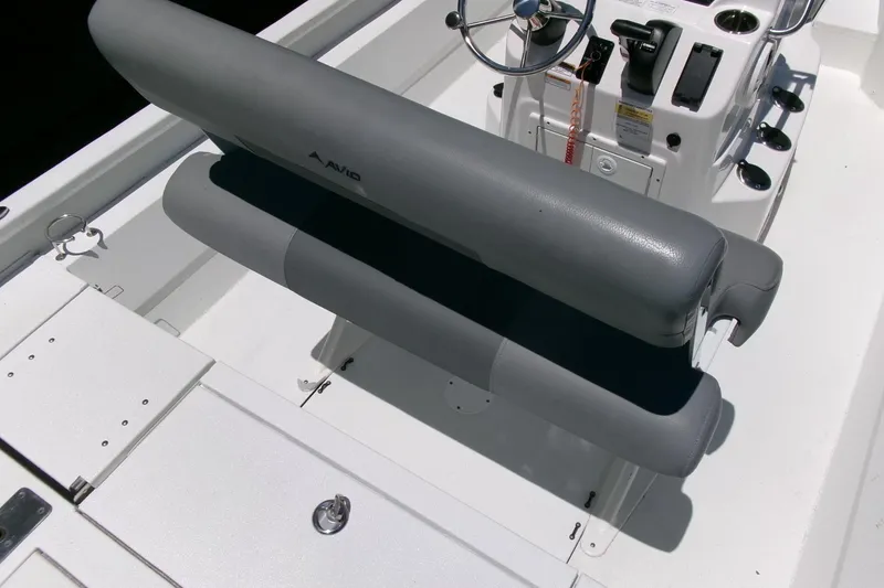 Slide: The Image of Avid 21 Fusion 2022 boat interior with gray seating and steering console. - 25