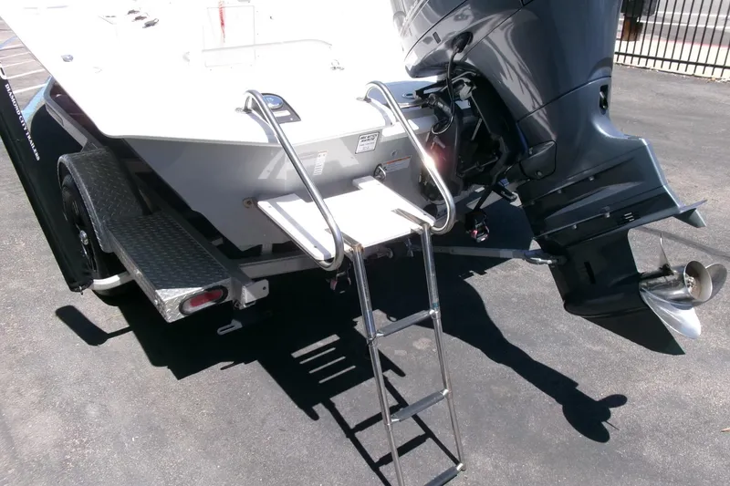 Slide: The Image of Avid 21 Fusion 2022 boat with ladder and outboard motor on trailer. - 29