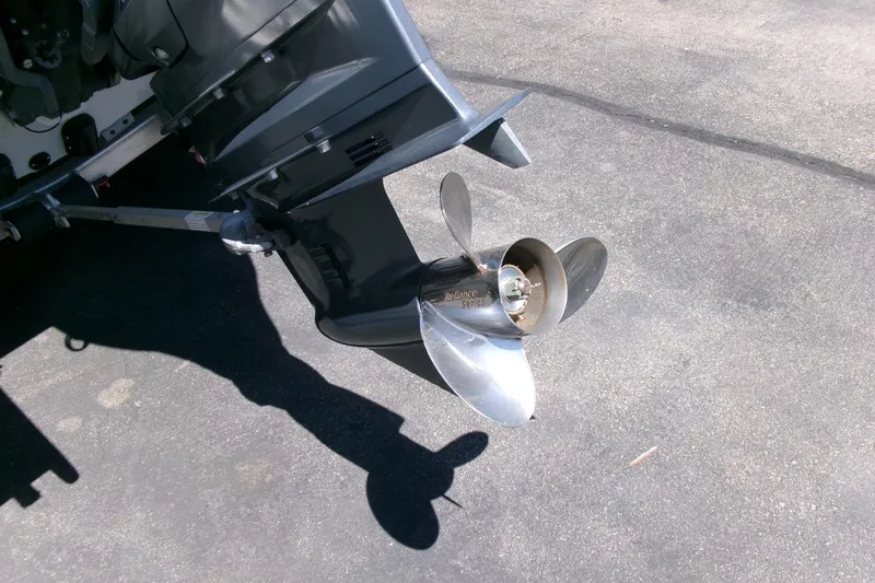 Slide: The Image of Outboard motor propeller of 2022 Avid 21 Fusion boat on pavement background. - 31