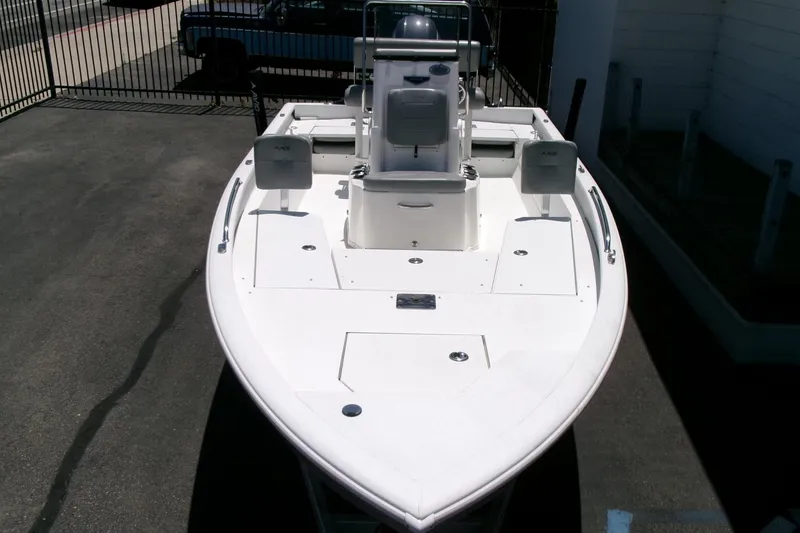 Slide: The Image of 2022 Avid 21 Fusion boat, white deck, parked outdoors, showcasing sleek design and modern features. - 32