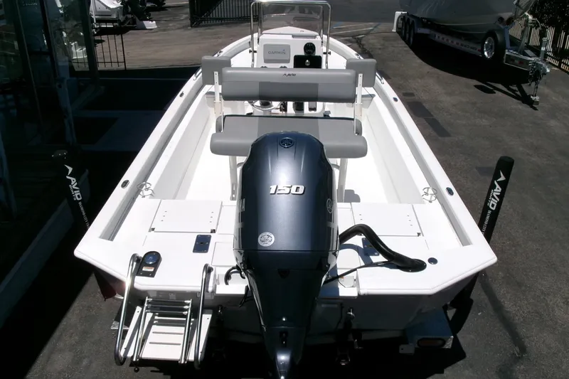 Slide: The Image of 2022 Avid 21 Fusion boat with Yamaha 150 engine, viewed from the rear on a trailer. - 33