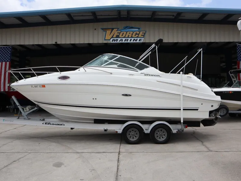 The Image of 2008 Sea Ray 240 Sundancer on trailer outside marine shop. - 1