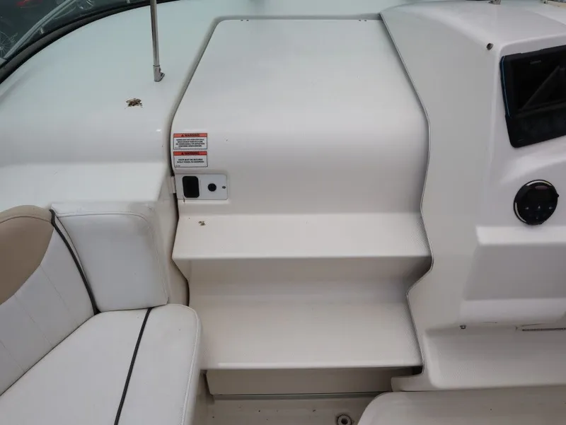 Slide: The Image of Interior of a 2008 Sea Ray 240 Sundancer with seating area. - 17