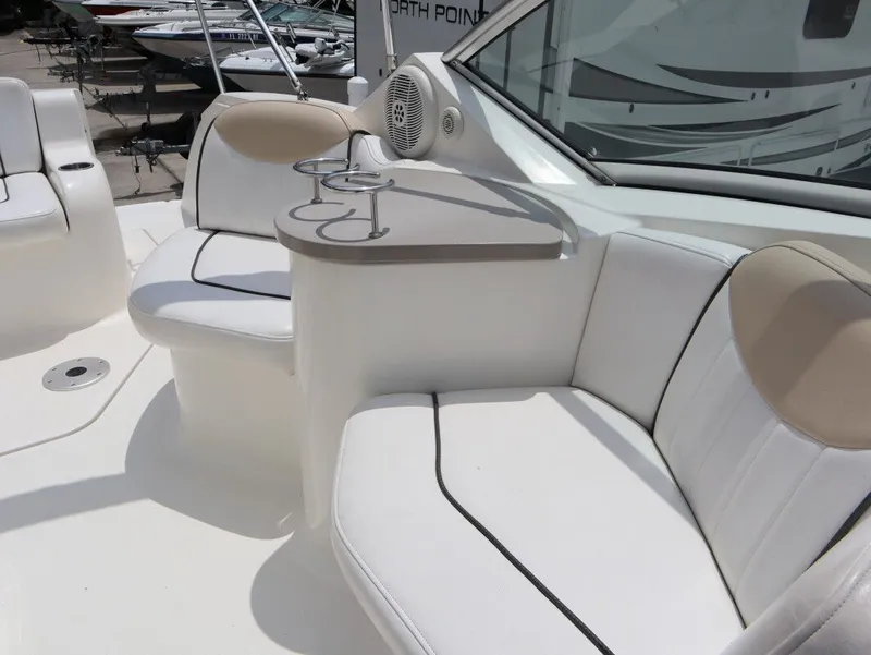 Slide: The Image of Interior of a 2008 Sea Ray 240 Sundancer with white seating. - 19