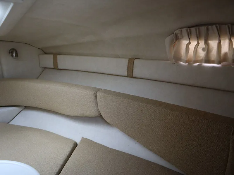 Slide: The Image of Interior of 2008 Sea Ray 240 Sundancer with cushioned seating. - 24