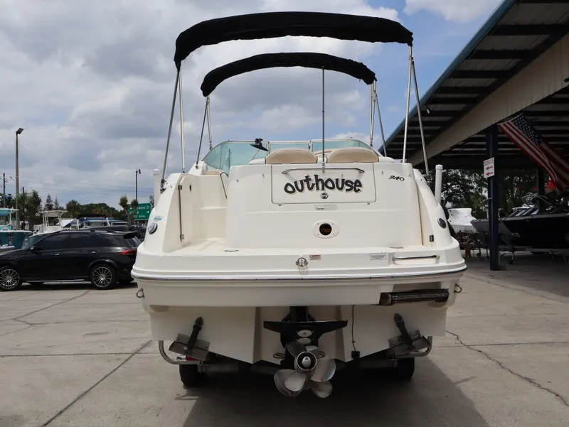 Slide: The Image of Rear view of a 2008 Sea Ray 240 Sundancer boat at the dock. - 4