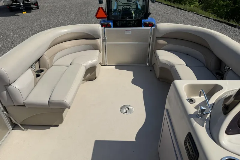 Slide: The Image of 2015 Starcraft Stardeck 216 Cruise-N-Fish boat interior with beige seating and console. - 11