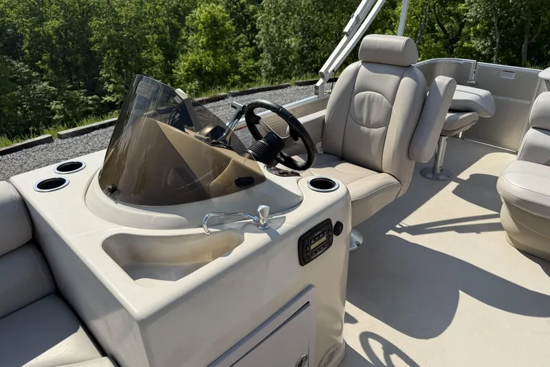 Slide: The Image of 2015 Starcraft Stardeck 216 Cruise-N-Fish boat interior with steering console and seating. - 13
