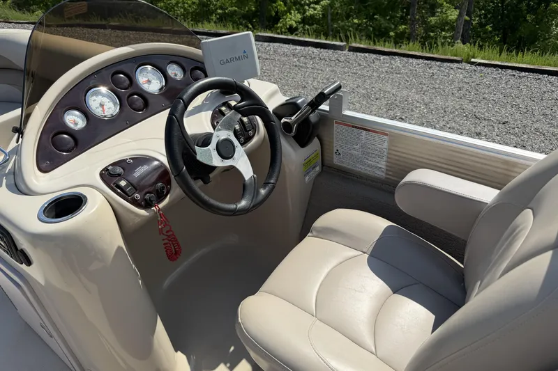 Slide: The Image of 2015 Starcraft Stardeck 216 Cruise-N-Fish boat dashboard with steering wheel and gauges. - 14