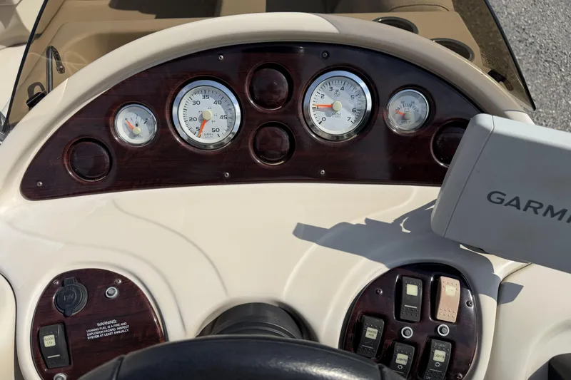 Slide: The Image of Dashboard of 2015 Starcraft Stardeck 216 Cruise-N-Fish with gauges and Garmin device. - 15