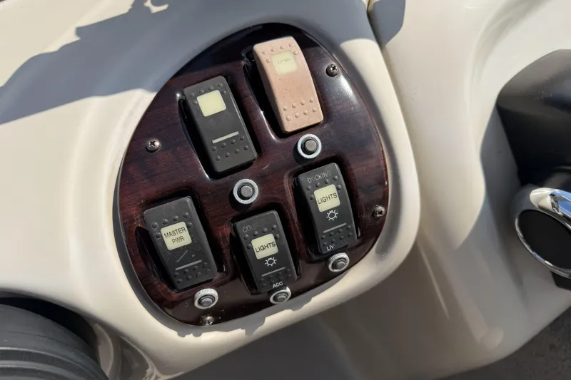 Slide: The Image of Control panel of a 2015 Starcraft Stardeck 216 Cruise-N-Fish boat with switches. - 16