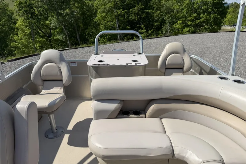 Slide: The Image of 2015 Starcraft Stardeck 216 Cruise-N-Fish boat interior with beige seating and fishing station. - 18