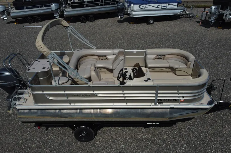 Slide: The Image of 2015 Starcraft Stardeck 216 Cruise-N-Fish pontoon boat with beige seating and Yamaha motor. - 2