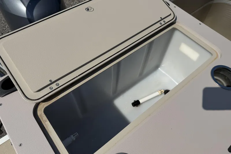 Slide: The Image of Open storage compartment on 2015 Starcraft Stardeck 216 Cruise-N-Fish boat. - 20