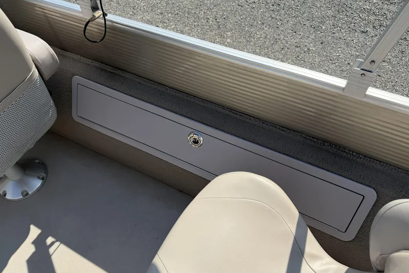 Slide: The Image of Interior view of a 2015 Starcraft Stardeck 216 Cruise-N-Fish boat, featuring seating and storage. - 21