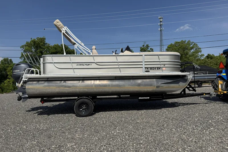 Slide: The Image of 2015 Starcraft Stardeck 216 Cruise-N-Fish pontoon boat on trailer, parked outdoors. - 5