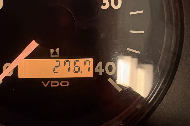 Slide: The Image of VDO tachometer displaying 276.7 hours on 1976 Hatteras 38 Double Cabin. - 16