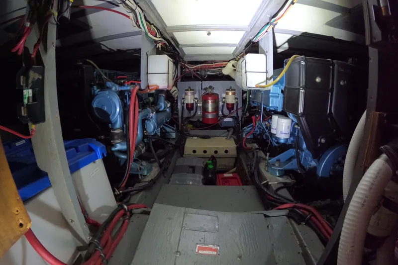 Slide: The Image of Engine room of 1976 Hatteras 38 Double Cabin with blue engines. - 29