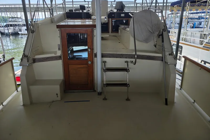 Slide: The Image of 1976 Hatteras 38 Double Cabin yacht in dock. - 3