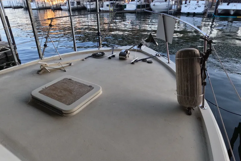 Slide: The Image of Deck of a 1976 Hatteras 38 Double Cabin boat in harbor. - 4