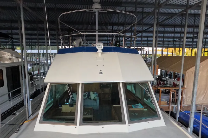 Slide: The Image of 1976 Hatteras 38 Double Cabin in covered marina. - 5