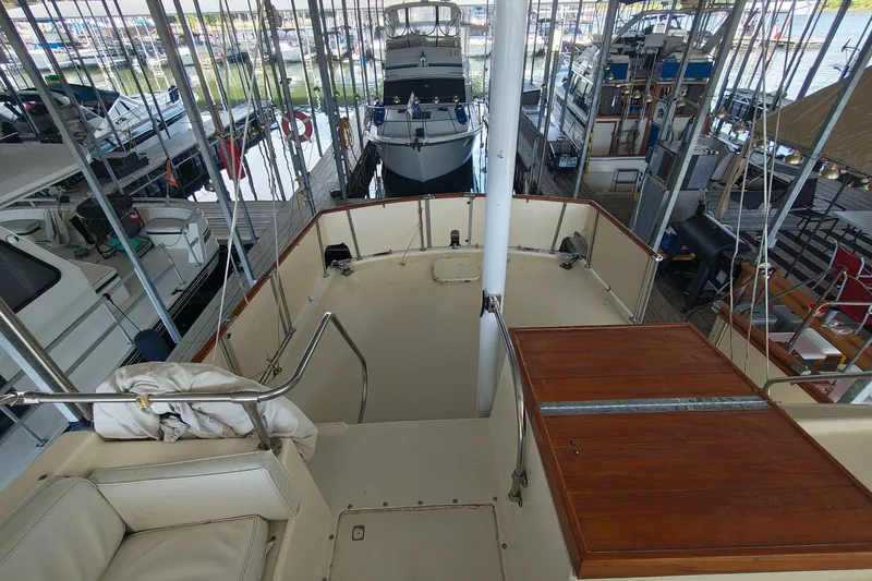 Slide: The Image of 1976 Hatteras 38 Double Cabin in marina, top deck view. - 9