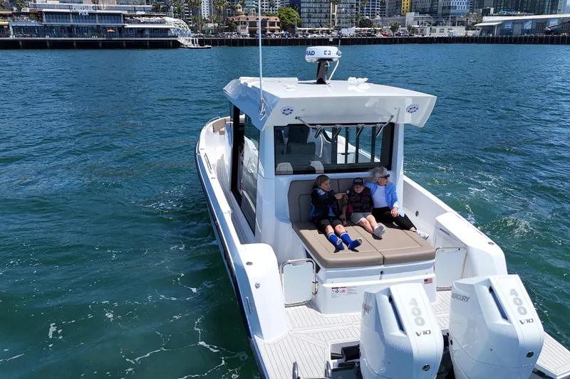 Slide: The Image of 2026 Cruisers Yachts 38 VTR on water, people relaxing on deck. - 16