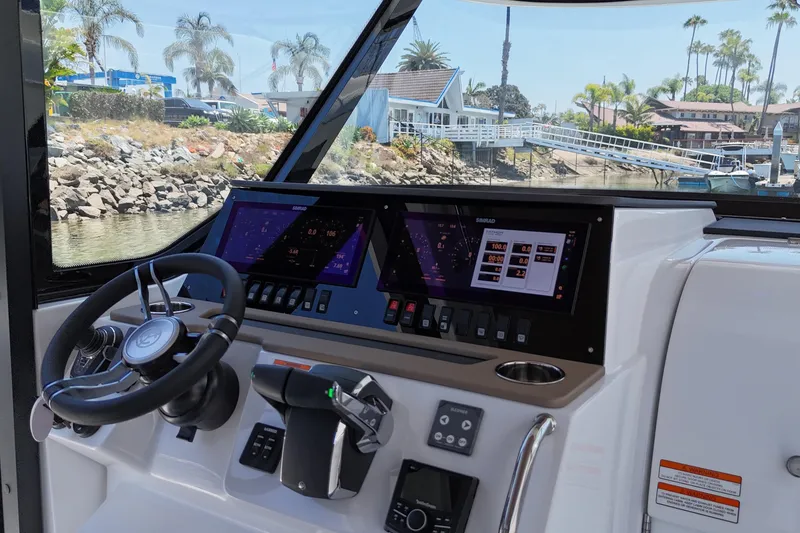 Slide: The Image of Helm of 2026 Cruisers Yachts 38 VTR with advanced navigation displays. - 18