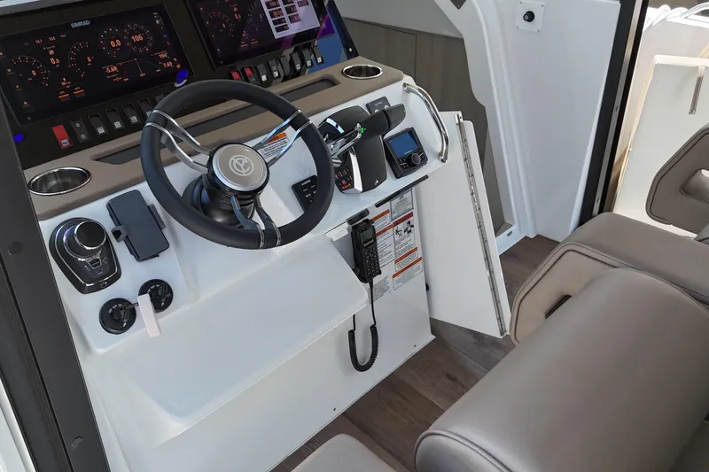 Slide: The Image of Helm of 2026 Cruisers Yachts 38 VTR with advanced navigation controls and modern design. - 20