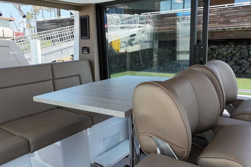 Slide: The Image of Interior of 2026 Cruisers Yachts 38 VTR with modern seating and table. - 21