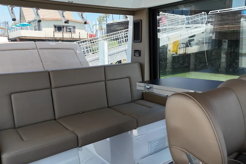 Slide: The Image of Luxurious interior of 2026 Cruisers Yachts 38 VTR with brown leather seating. - 22